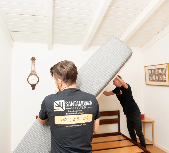 Movers lifting a mattress